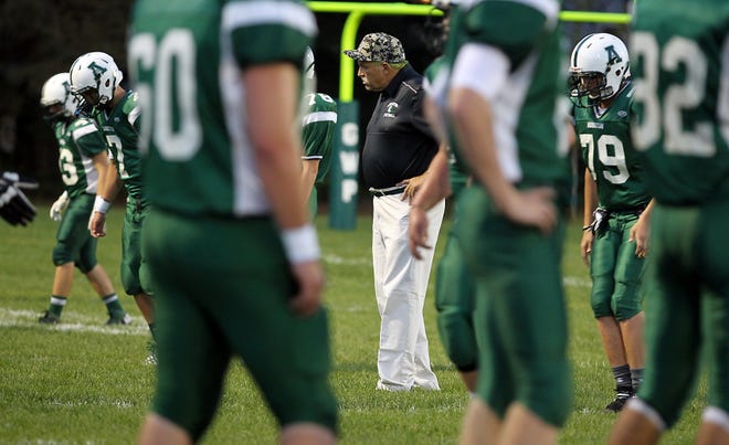 Abington head coach Jim Kelliher is in the middle of warmups before their game against Wakefield on Friday, Sept. 18, 2015. [Wicked Local Staff Photo/Robin Chan]