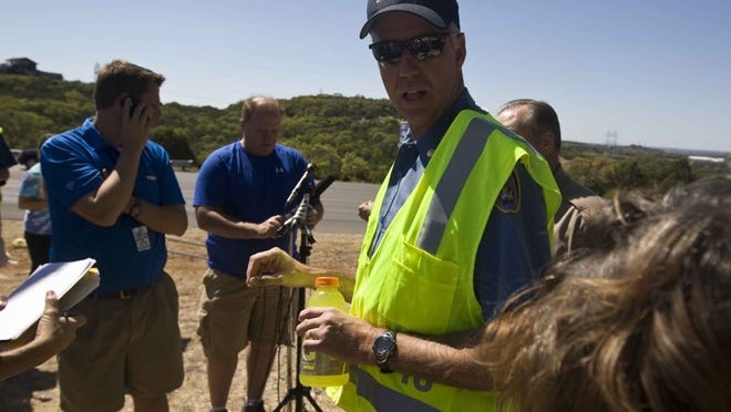 Lt. Jim Baker gives the media updates about the wild fire and peoples homes on Monday, September 5, 2011.