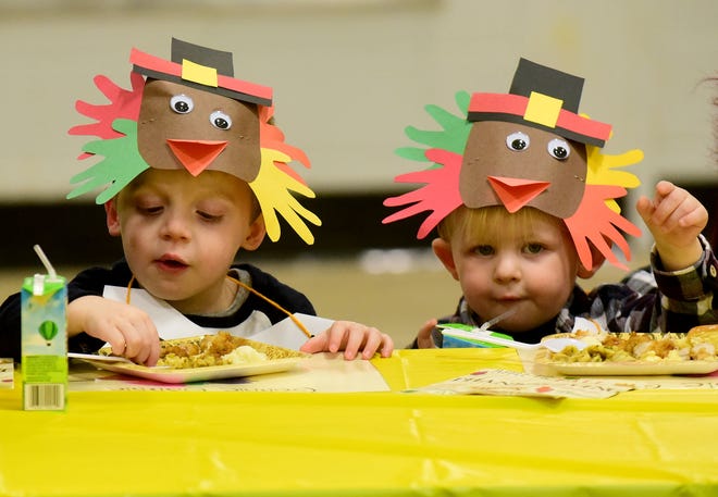 Travis Strauss (left), 3, and David Wood, 2, sample different types of foods during the fourth annual Thanksgiving feast at Marlton Middle School's Teddy Bear Academy in Evesham Township on Wednesday, Nov. 22, 2017. Teachers cooked a special meal for the students.  [CARL KOSOLA / STAFF PHOTOJOURNALIST]