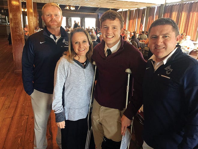 Mavericks' quarterback Stanton Martin, third from left, attends Monday's weekly luncheon of the Knoxville Quarterback. Also pictured from left are ACHS coach Davey Gillum; Jenny Martin, Stanton's mother; and ACHS athletic director/assitant coach Gary Terry.