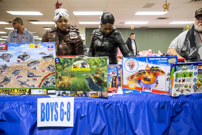 Orea Runnels shops for a gift in the boys section as she picks out toys for her four children at Salvation Army, Thursday, Dec. 20, 2012, in Springfield. The Salvation Army is giving out food toys and clothing to 857 families. Justin L. Fowler/The State Journal-Register