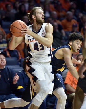 Illinois forward Michael Finke (43) looks for an open pass under pressure from Augustana's Donovan Ferguson (42) during the first half of an NCAA college basketball game at the State Farm Center Wednesday, Nov. 22, 2017, in Champaign, Ill. (Stephen Haas/The News-Gazette via AP)