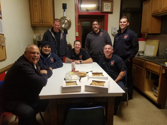 Left to right: Fall River District Fire Chief David Levesque, Dennis Sardinha, Ryan Hebda, Jake Ramunno, Lt. Paul Machado, Nate Lowney and Robert Forand on duty at the Central Fire Station on Thanksgiving. [Herald News photo by Brian Fraga]