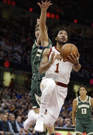 Cleveland Cavaliers' Derrick Rose (1) drives to the basket against Milwaukee Bucks' Mirza Teletovic (35) in the first half of a game, Nov. 7 in Cleveland. (AP Photo/Tony Dejak)