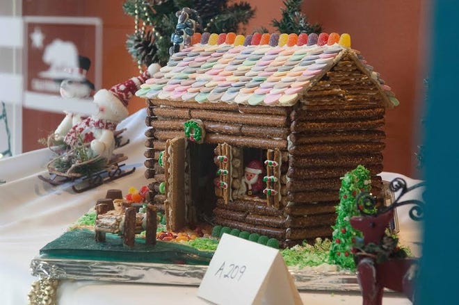 This gingerbread house entered in the New Bern Historical Society Gingerbread House Contest features Santa through an open windown. The crafted gingerbread houses are on display in windows of downtown New Bern merchants as a new edition to the annual Beary Merry Christmas celebration. [CONTRIBUTED PHOTO]