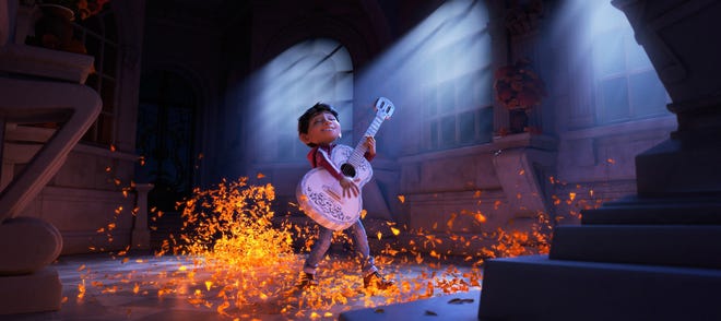 Miguel (voice of newcomer Anthony Gonzalez) dreams of becoming an accomplished musician like the celebrated Ernesto de la Cruz (voice of Benjamin Bratt) in the Disney Pixar film "Coco." [PIXAR]