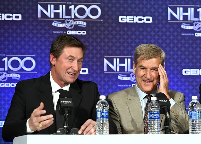 Former NHL players Wayne Gretzky, left, and Bobby Orr speak during a news conference before an NHL 100 ceremony in January in Los Angeles. The NHL wraps up its centennial celebration with a documentary covering the leagues' first 100 years. [Mark J. Terrill/The Associated Press]