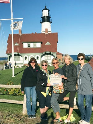 Betsy DeFelice, Beth Hower, Darlene Hartzler, Jill Buckingham and Jeannette Hanzie took a girls’ trip to Portland, Maine, and stopped at the famous Portland Head Light Lighthouse with their copy of The Daily Record. The group also visited Kennebunkport, the LL Bean stores, and learned to bait and catch lobster on the Lucky Catch Cruise at the pier.