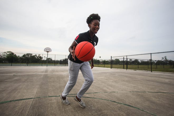 Fourteen-year-old Charnetta Brown says she wants to be a professional basketball player when she grows up — or maybe a neurosurgeon. [News-Journal / LOLA GOMEZ]