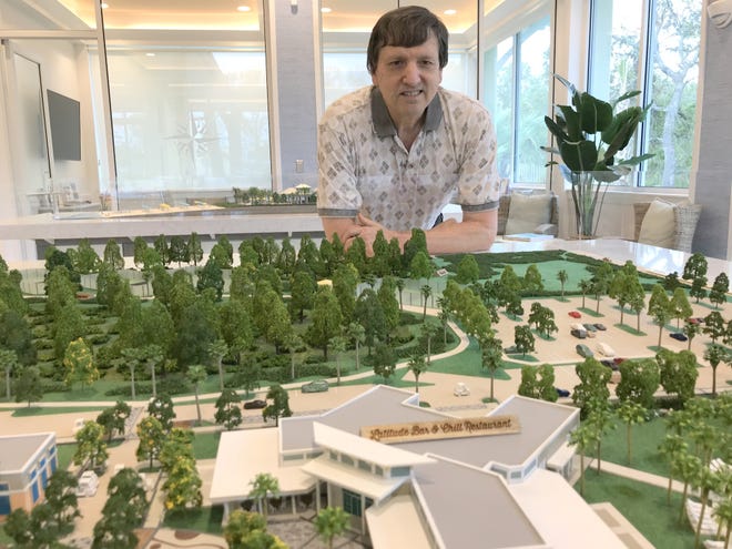 Branson, Missouri resident Jim Pendley looks at a scale model of the planned amenities center at Latitude Margaritaville Daytona Beach on Tuesday,. Nov. 21, 2017. [News-Journal/Clayton Park}