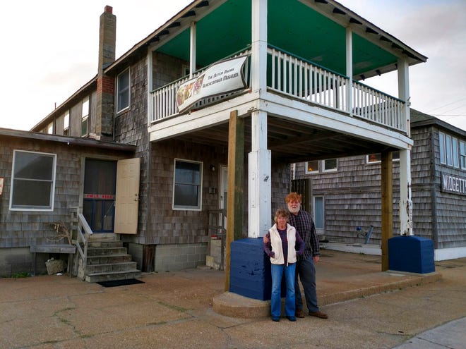 Chaz Winkler and Dorothy Hope stand in front of the Outer Banks Beachcomber Museum this month. (Jeff Hampton/The Virginian-Pilot via AP)