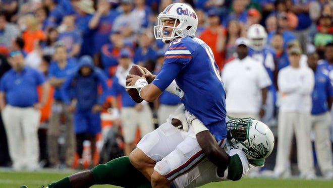 Florida quarterback Feleipe Franks hopes for better protection and results against Florida State today. (AP Photo/John Raoux)