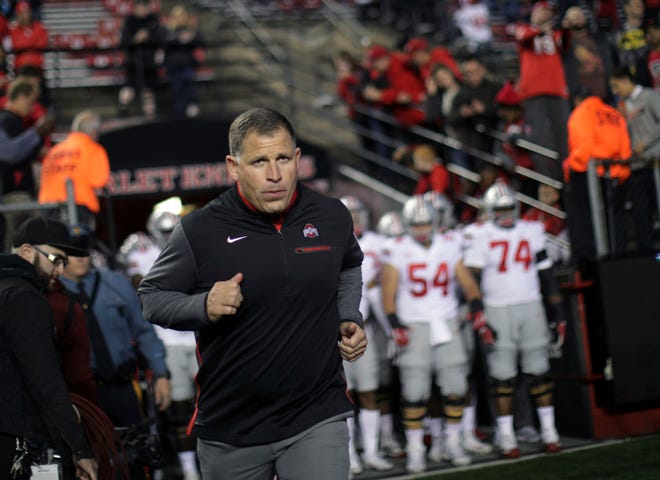 This Sept. 30, 2017 file photo shows former Rutgers football head coach, now Ohio State associate head coach/defensive coordinator Greg Schiano running onto the field before a game against Rutgers in Piscataway, N.J.. (AP Photo/Mel Evans, file)