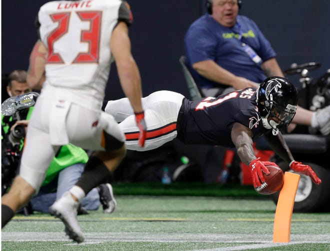 Atlanta's Julio Jones (11) scores a touchdown against Tampa Bay during the first half Sunday in Atlanta. [Associated Press/Chris O'Meara]