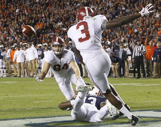 Alabama tight end Hale Hentges (84) dives for a pass intended for Alabama wide receiver Calvin Ridley (3) that was deflected by Auburn defenders in the end zone on Saturday, Nov. 25, 2017. It was ruled a catch but was overturned by the officials. Alabama had 168 passing yards in Saturday's loss. [Staff Photo/Gary Cosby Jr.]