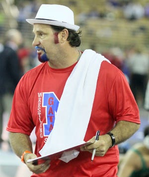 Manatee High coach Andy Gugliemini looks stylish at the FHSAA State Wrestling Championships at Silver Spurs Arena in Kissimmee in 2016. [STAFF FILE PHOTO / DENNIS MAFFEZZOLI]
