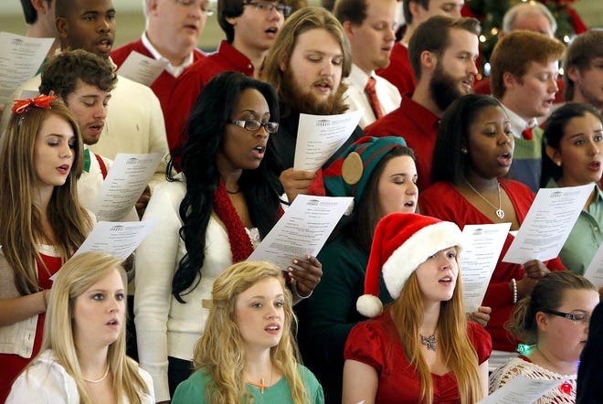 The Shelton Singers perform Christmas carols at Shelton State Community College in Tuscaloosa, Ala. Tuesday, Dec. 3, 2013. As part of the Terrific Tuesday Concert Series the Shelton Singers, along with special guests, held the College Christmas Tree Lighting in the atrium Tuesday. staff photo | Dusty Compton