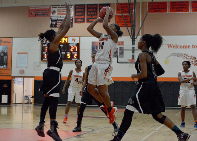 Leesburg's Eletra Graham (14) takes a shot during a game against West Port in Leesburg on Jan. 17. [Daily Commercial file]
