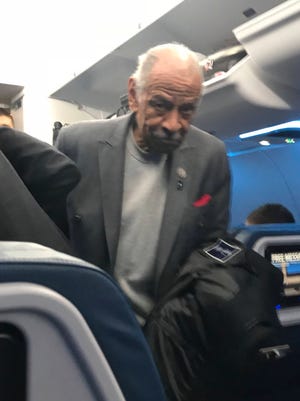 In this photo provided by Dennis Lennox, Democratic Rep. John Conyers, the longest serving member of the House, is seen on a plane to Detroit on Tuesday, Nov. 28, 2017. Conyers missed two roll call votes in the House Tuesday night and was photographed by a passenger boarding a Delta Airlines flight to Detroit. Conyers is accused of sexual misconduct by a former staffer. (Dennis Lennox/Twitter via AP)