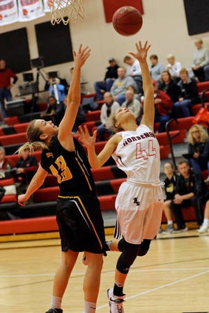 Kylie Tjernagel goes for the lay up. Photo by Kevin Patterson