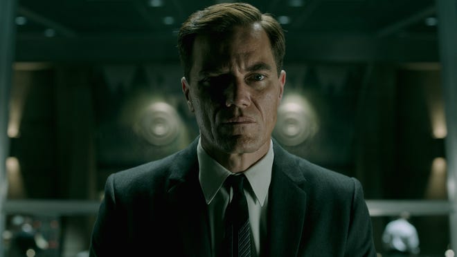 Mysterious government man Richard Strickland (Michael Shannon) seems uninterested in cracking a smile. [Twentieth Century Fox]