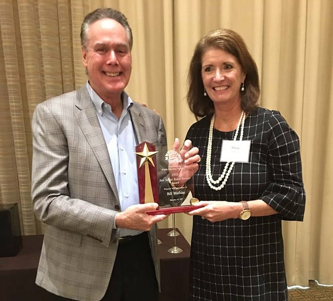 Bill Mathias received the Consortium of Florida Education Foundation's "Star" school board member of the year award from Consortium President Mary Chance. Mathias received the award Thursday in Tampa.