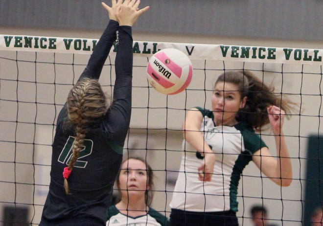 Venice's Kelly Hubbard slams one of her 22 kills past Lakewood Ranch's Maddie Koczersut in the Class 8A-District 11 semifinals at the Indians Teepee. [HERALD-TRIBUNE STAFF PHOTO / DENNIS MAFFEZZOLI]