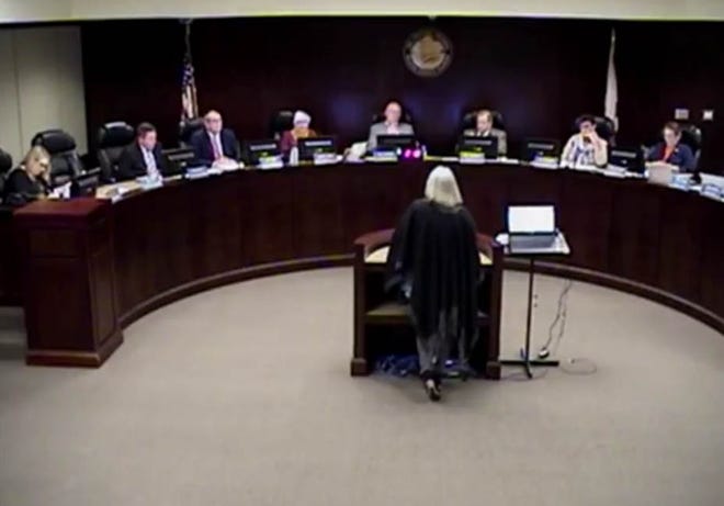 Linda Morse talks to the Walton County Commissioners during a recent meeting and asks if the county does background checks on employees. [CONTRIBUTED PHOTO]