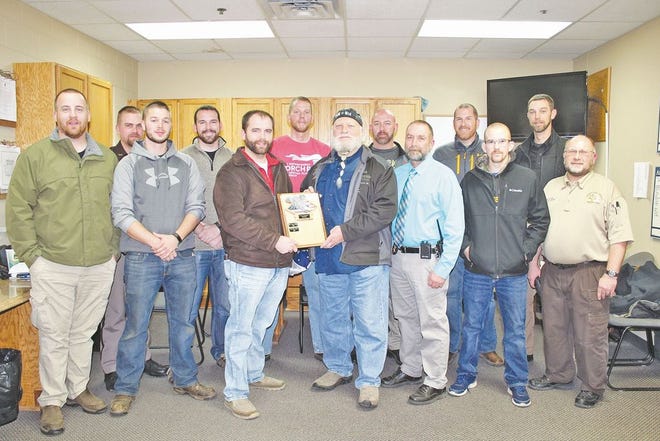 20 members of the Cheboygan County Sheriff's Department participated in No Shave November to raise funds for Toys for Kids. Corrections Corporal Nick Jamieson, center left, took home the award this year for the best beard, as judged by the ladies from the Cheboygan County Prosecutor's Office and Duke Mayo, center right.