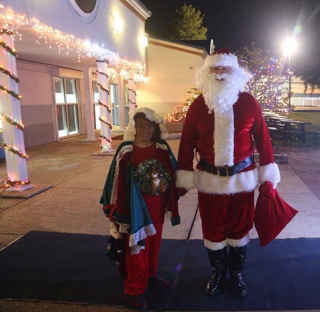 Santa makes his appearance during the Destin Tree Lighting event at the Community Center Thursday night. [MICHAEL SNYDER/THE LOG]