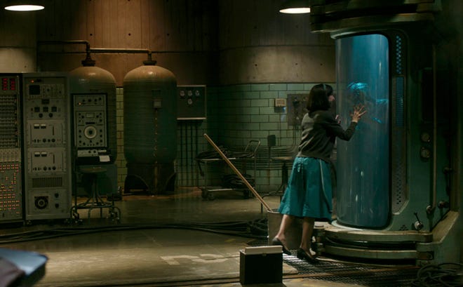 This image released by Fox Searchlight Pictures shows Sally Hawkins and Doug Jones in a scene from the film “The Shape of Water.” (Fox Searchlight Pictures via AP)