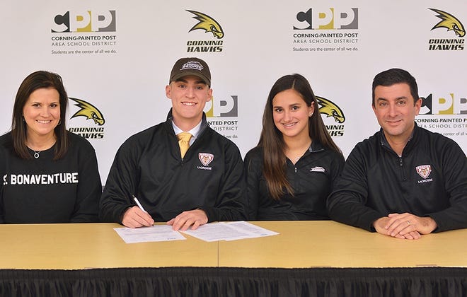 Corning-Painted Post lacrosse player Ryan Burns signed his letter of intent to play at St. Bonaventure Friday at the high school. [ERIC WENSEL/THE LEADER]