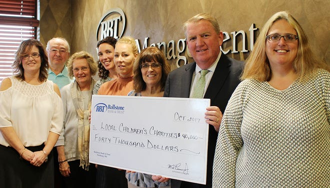 From left, Maribeth Janssens, director of community impact, UWNCM/F2B; Phil DeCisero, Pam DeCisero and Jillean Price, board members at Karen's Closet; Stacy Maillet, director, Nicholas James Foundation; Lori Bateman, executive director, Kylee's Kare Kits for Kidz; Martin F. Connors Jr., president and CEO of Rollstone Bank & Trust, and Larissa Murphy, secretary, Board of Directors, LEAD. SUBMITTED PHOTO