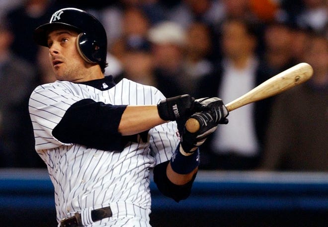 Aaron Boone, who played in 54 games with the Yankees in 2003, was named the team's manager on Friday night.