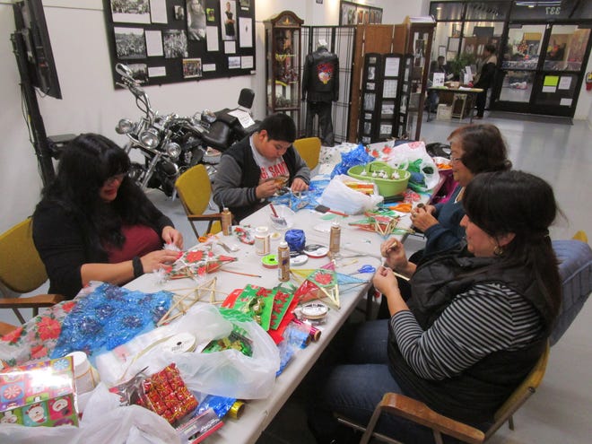 Create a parol — a Filipino Star Lantern — on Dec. 9 during a decorating workshop at the Filipino American National Historical Society National Museum. [COURTESY OF JOY NEAS]