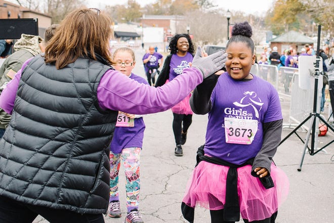 More than 1,000 young girls and their running buddies hit the streets of Belmont for the Girls on the Run Fall 5k on Saturday morning, Dec. 2, 2017. [MEGAN HITCHENS PHOTOGRAPHY/SPECIAL TO THE GAZETTE]