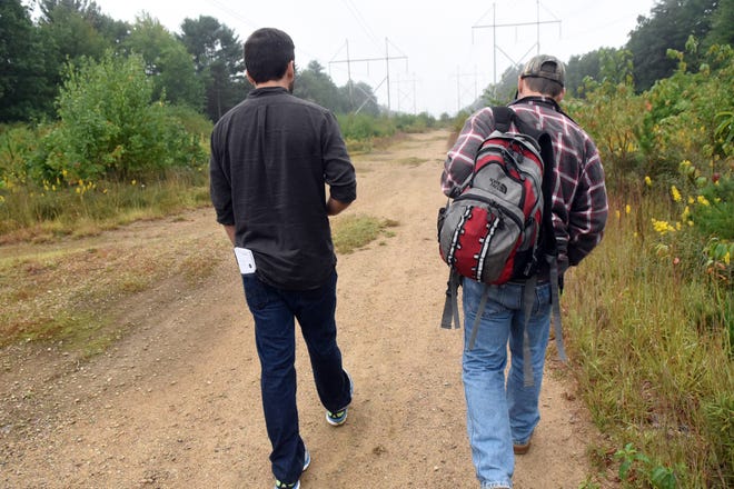 Seacoast Media Group staff writer Kyle Stucker, left, walks along with a homeless man during his investigation of homelessness on the Seacoast. [Deb Cram/Seacoastonline, file]