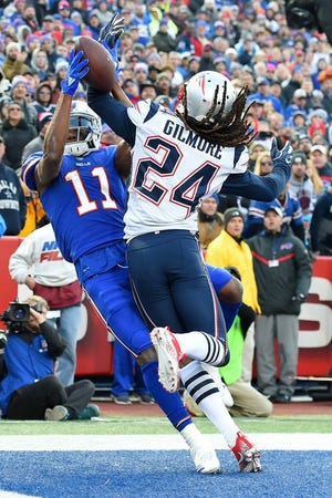 New England Patriots cornerback Stephon Gilmore (24) knocks a pass out of the hands of Buffalo Bills wide receiver Zay Jones (11) during the second half of an NFL football game, Sunday, Dec. 3, 2017, in Orchard Park, N.Y.