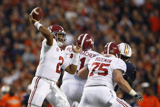 Alabama QB Jalen Hurts throws the ball during the Iron Bowl on Nov. 25 against Auburn in Auburn, Ala. The College Football Playoff selection committee chose Alabama for the fourth and final spot over Ohio State on Sunday. [FILE PHOTO / THE ASSOCIATED PRESS]