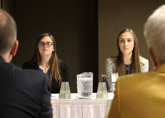 Abigail Kluttz, left, and Madeline Wilson, both seniors at Calvary Lutheran High School in Jefferson City, listen as judges ask them questions about what role political parties have in the U.S. Kluttz and Wilson were among more than 75 high school students who participated in the Missouri Bar's annual We the People and Show Me the Constitution competitions at the Courtyard Marriott in Columbia on Monday. [Megan Favignano/Tribune]