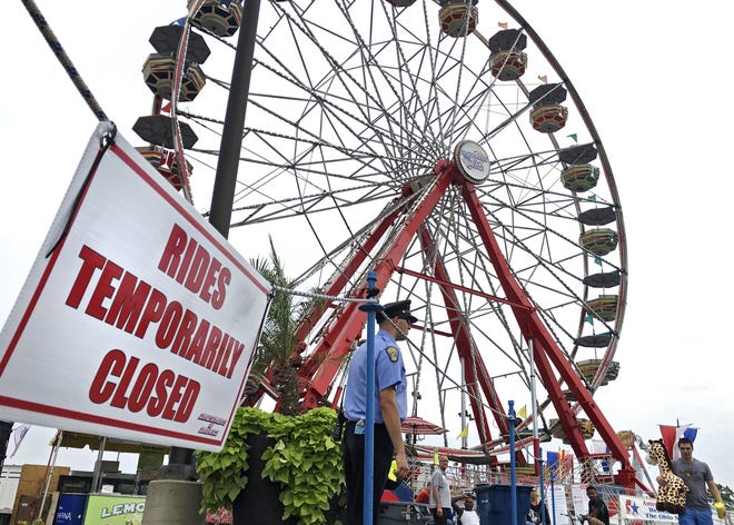 FILE - Rides on the midway were shutdown after the Fire Ball ride failed the previous night and killed one fair visitor at the Ohio State Fair July 27, 2017.[Eric Albrecht/Dispatch]
