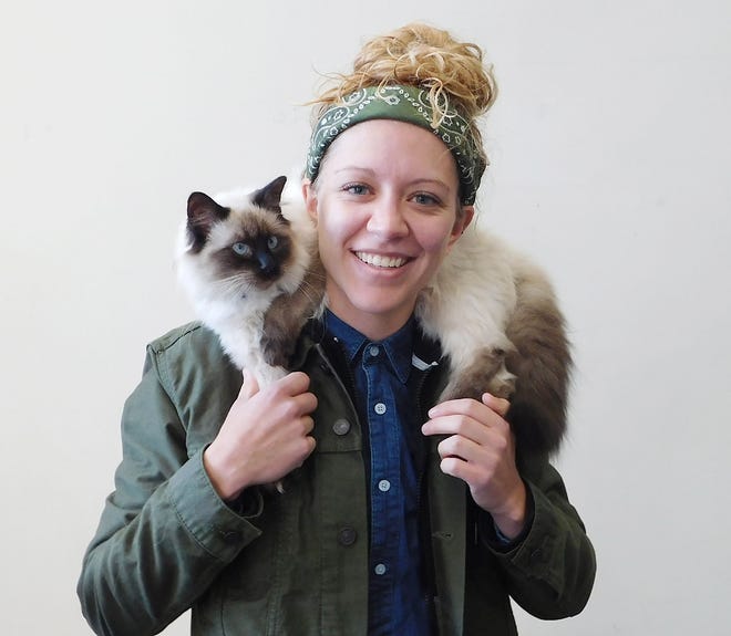 Alexis Gilbert, of Mohawk, poses with her cat Rigby at the Times Telegram office on Monday after Rigby won the Times Telegram’s 2018 Pet Calendar Contest. Rigby will be featured in the Times Telegram’s 2018 Pet Calendar along with 11 other winners. [STEPHANIE SORRELL-WHITE/TIMES TELEGRAM]