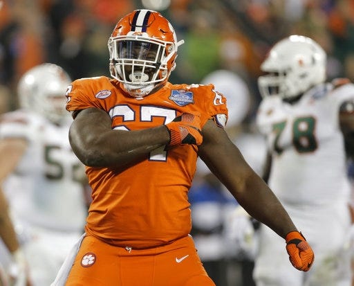 Clemson's Albert Huggins (67) celebrates after a sack against Miami during the second half of the Atlantic Coast Conference championship NCAA college football game in Charlotte, N.C., Saturday, Dec. 2, 2017. (AP Photo/Bob Leverone)