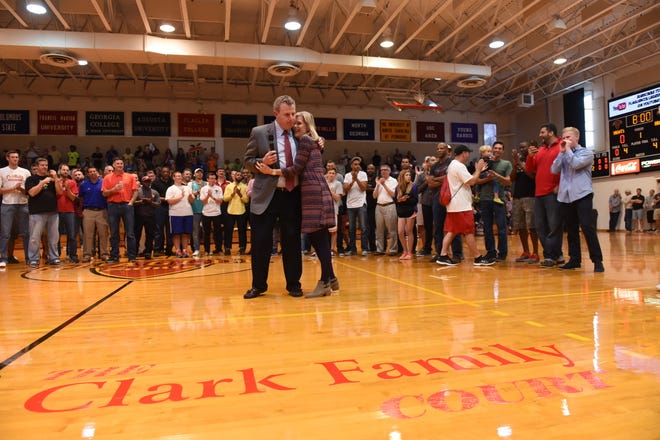 CHRISTINA.KELSO@STAUGUSTINE.COM Nancy Clark hugs husband Bo on the newly named “Clark Family Court” during Bo Clark Day at Flagler Gymnasium on Feb. 18, 2017. Tonight, Clark will have his high school number retired on Bo Clark Night at Bishop Moore High School in Orlando.