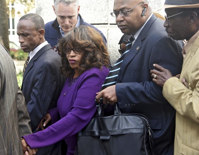 Former U.S. Rep. Corrine Brown walks out of the federal courthouse in Jacksonville Monday after being sentenced to five years in prison on fraud charges in connection with a charity, One Door for Education. [Bob Mack/Florida Times-Union via AP]