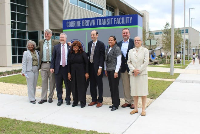 Former U.S. Rep. Corrine Brown, center, poses with the Gainesville City Commission in November 2014 for a ribbon-cutting ceremony at the Regional Transit System facility, named for her. [Photo courtesy of RTS via Facebook]