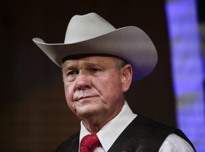 FILE - In this Monday, Sept. 25, 2017, file photo, former Alabama Chief Justice and U.S. Senate candidate Roy Moore speaks at a rally, in Fairhope, Ala. In the face of sexual misconduct allegations, Moore's U.S. Senate campaign has been punctuated by tense moments and long stretches without public appearances. Moore faces Democrat Doug Jones for Alabama's U.S. Senate seat in the Dec. 12 election. (AP Photo/Brynn Anderson, File)