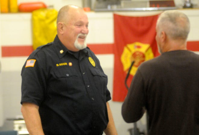 Polk-Jackson-Perry Fire Chief Randy Goon speaks with friend Rod Rogers on Sunday at the firehouse during an open house in Goon's honor. He retired after 45 years of service, and 32 years as chief.