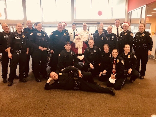 Middletown and Lower Southampton police at Shop with a Cop pose with Santa at Target on Sunday, Dec. 3, 2017. [MIDDLETOWN POLICE PHOTO]