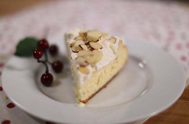 You can make this luscious cheesecake child-friendly by omitting the amaretto from the mousse topping. [The Providence Journal / Glenn Osmundson]